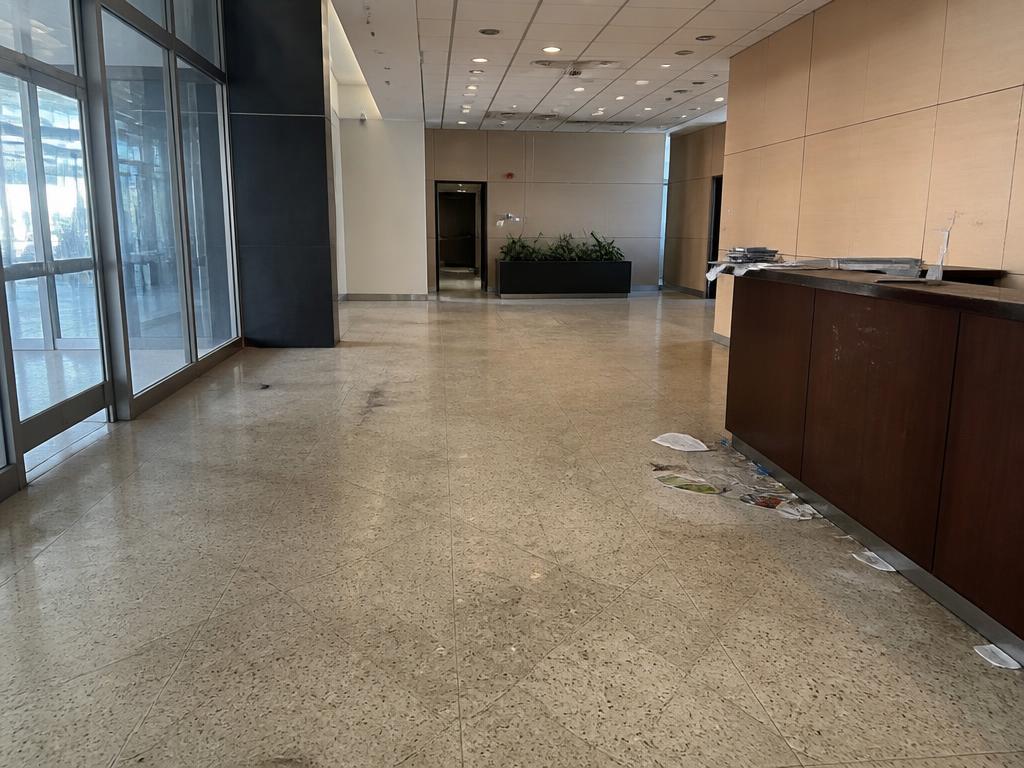 Before: Office lobby — daily traffic buildup vs. after nightly janitorial service